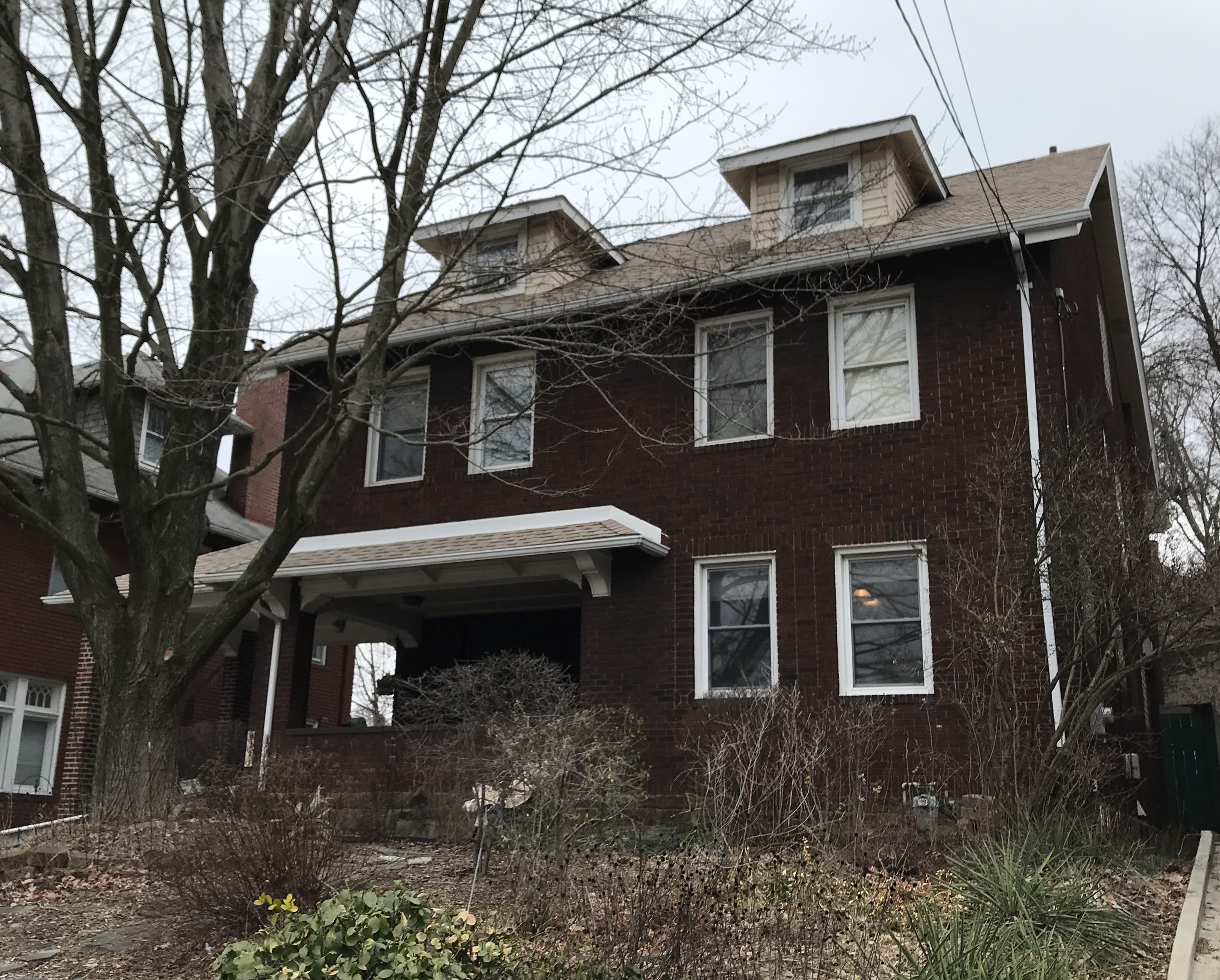 Stack of three green cardstock boxes with 3 hole cutouts showing cards inside.